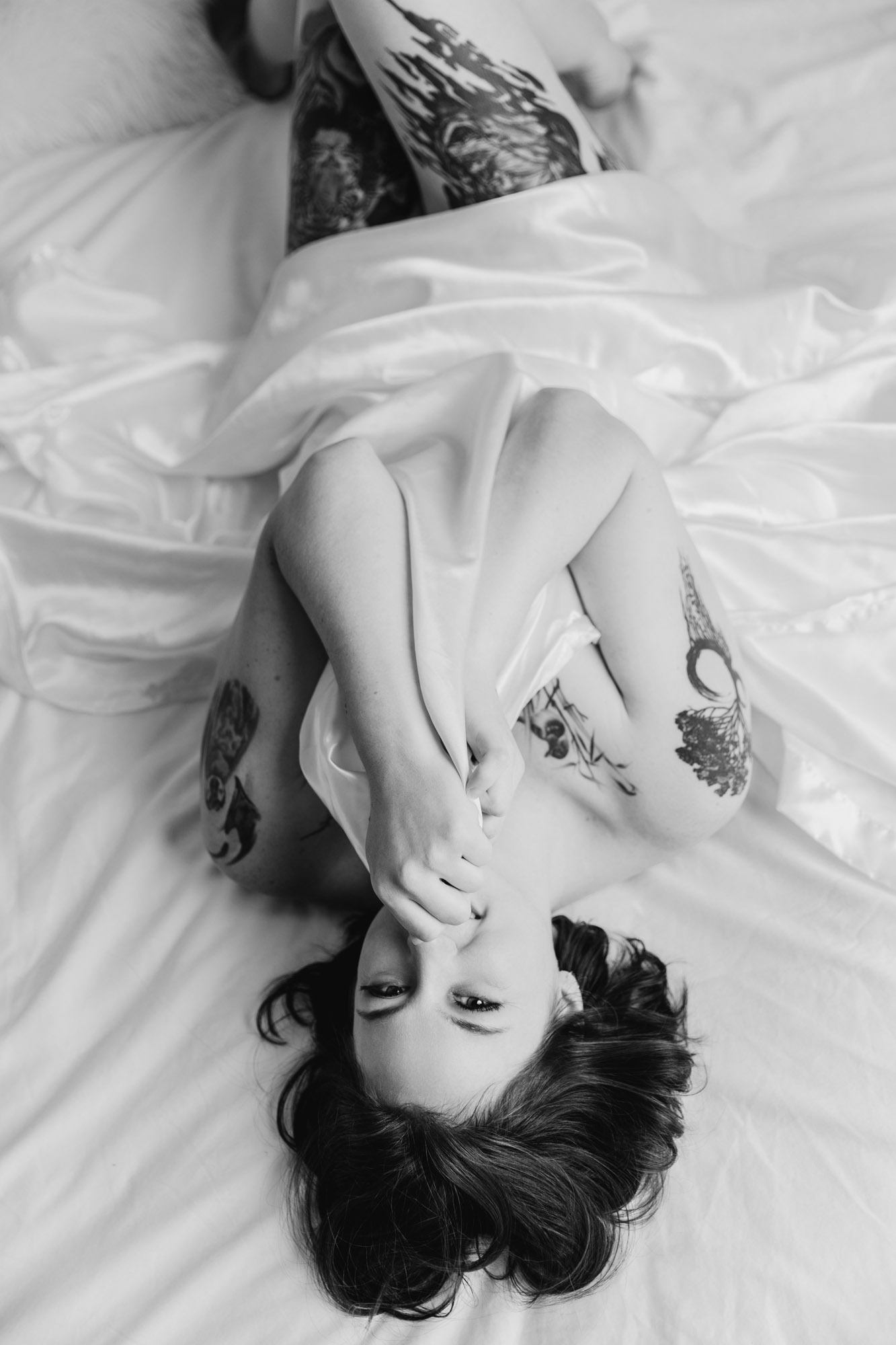 Top-down black-and-white editorial boudoir portrait